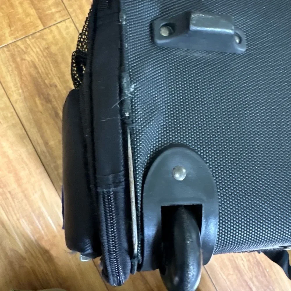 Eddie Bauer black expandable handle, rolling small pet carrier. ￼